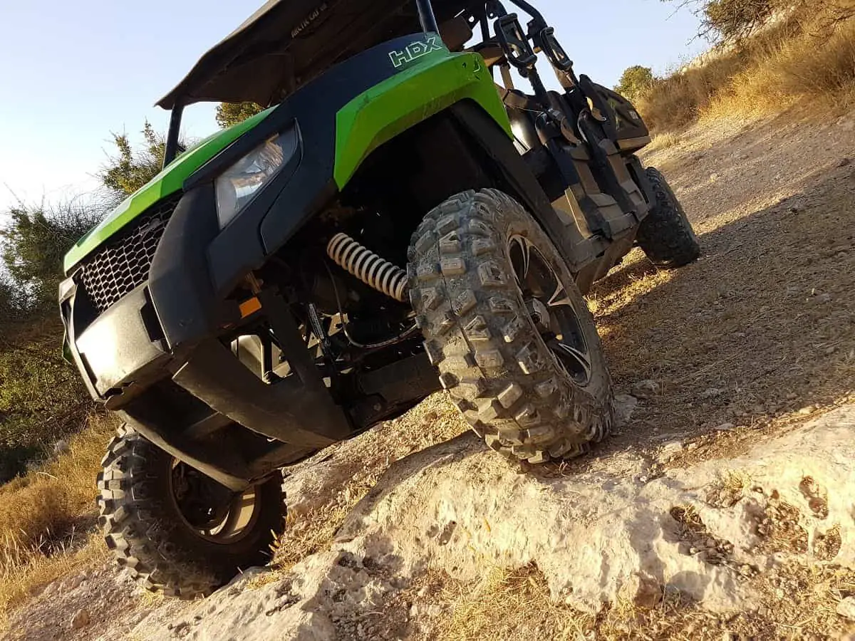 Buggy climbing a rock ledge